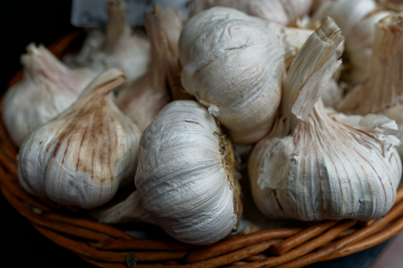 Basket filled with whole garlic bulbs